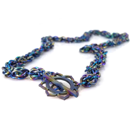 Rainbow anodized titanium mobius and sweet pea chainmaille necklace with titanium sun lotus toggle clasp